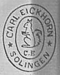 1933-1935: Double oval, serrated tail, with" CE"